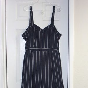 Navy blue and white striped jumpsuit with tie
